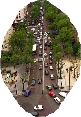 Lots of cars pointed in various directions on a street